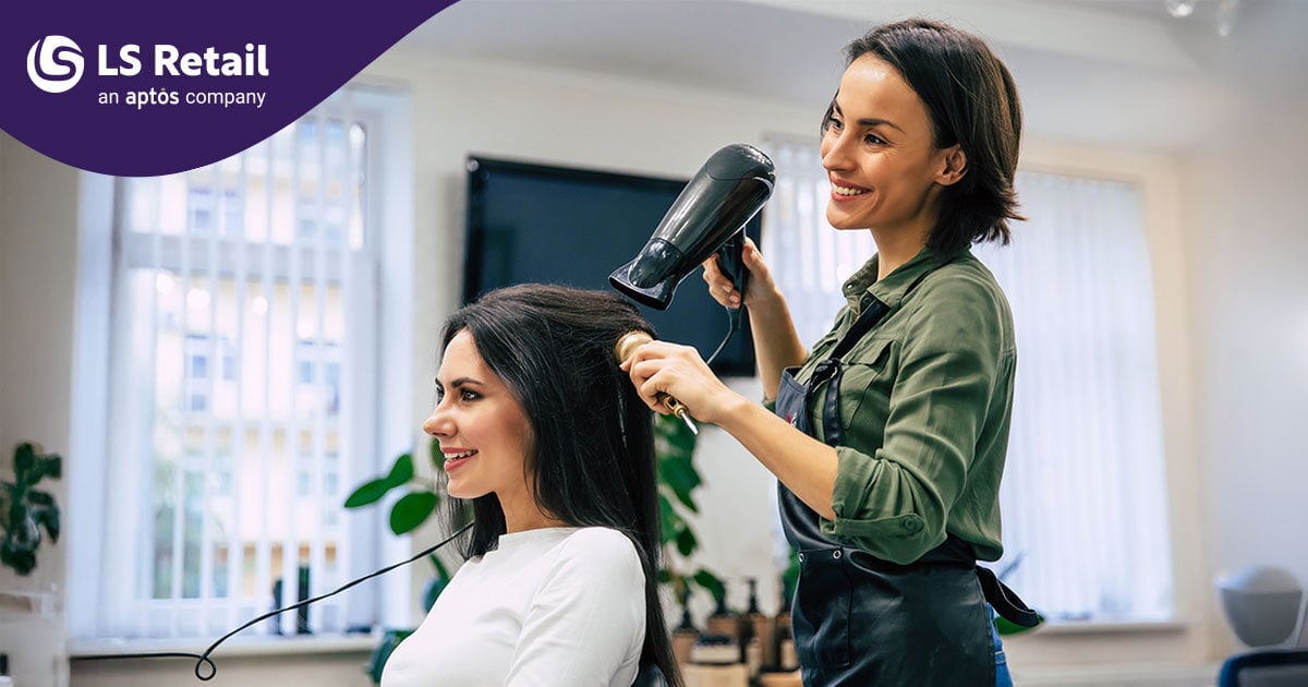 Woman styling another woman's hair at salon